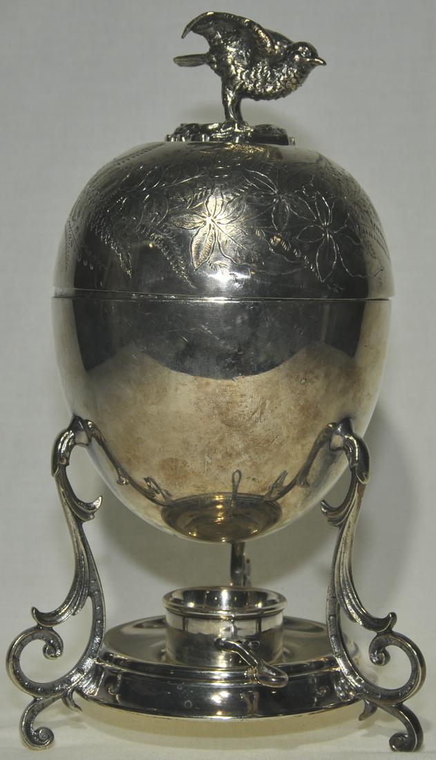 Mappin & Webb Figural Egg Coddler: Circa 1890, complete with egg rack and spirit burner holder. 9 in. excellent condition.
