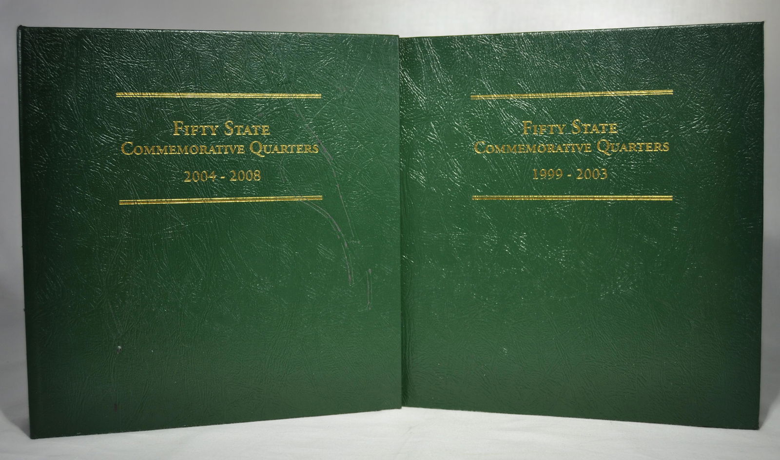 Littleton 50 State Commemorative Quarter Series: Volume One 1999 - 2003, volume 2 2004 -2008, 168) coins total, no silver proofs.