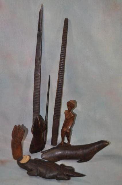 Native American Carvings, Estate Collection 8pcs: (1) Lizard, L 12", (1) seal, L 12 1/2", (1) Indian figure, H 10 1/4", (1) standing abstract, H 7 3/4", (1) fist, H 7", (2) grooved rods with stick