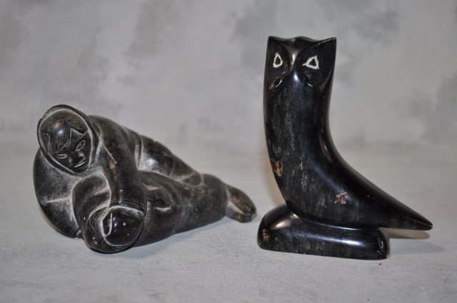 Inuit Stone Carvings, 2pcs: (1) Man grappling with walrus, 2 3/4" x 5 1/2", small ship to back flipper of walrus, (1) black stone owl, 4 1/2" x 3 1/2"