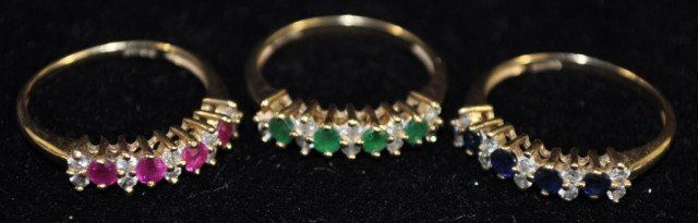 3 Stamped 14kt Gemstone and Diamond Stack Rings: Gemstones include sapphire, emerald and ruby, size 7, total weight: 4.25dwt / 6.6g