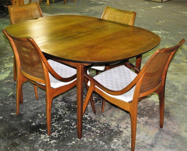 Mahogany Dining Table and Chairs: Mid Century, together with(1) table, 29" x 54" x 43", (4) woven wicker back and upholstered seats chairs, H 34"