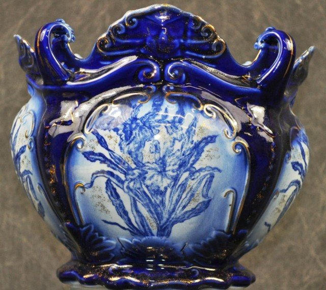 Ironstone Jardiniere: Shaded cobalt glazing w/daffodil transfer decoration and gold embellishments. H 9" D 12"