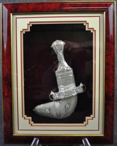 Presentation Kananjar Knife: Presented in shadow box frame, from Oman, sterling clad, overall size: 19" x 15"
