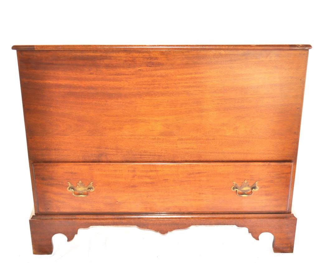 Chippendale Style Cedar Lined Blanket Chest: Circa 1930, rectangular mahogany top opening above a conforming case, housing a deep storage compartment and one deep drawer w/escutcheon pulls, rising on continuous bracketed apron foot; Measurements