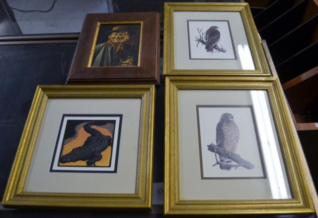 Decorative Wall Art 4 Pieces: (2) Featuring Perched Raptors, (1) Man Smoking Pipe, (1) Alligator, Measurements: Ranging In Size From: 10 3/4" x 8 3/4" To 10" x 11 1/2"