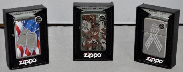 Zippo Lighters, 3 Pieces: (1) Camouflage, (1) Dog tags In front Of U.S. Flag, (1) Stars and Stripes Ribbon, Measurements: 2 1/4" 2 1/2" x 1/2"