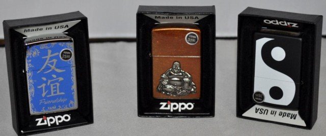 Zippo Lighters, 3 Pieces: (1) Yin and Yang, (1) Seated Buddha, (1) Chinese Characters and "Friendship", Measurements: 2 1/4" 2 1/2" x 1/2"