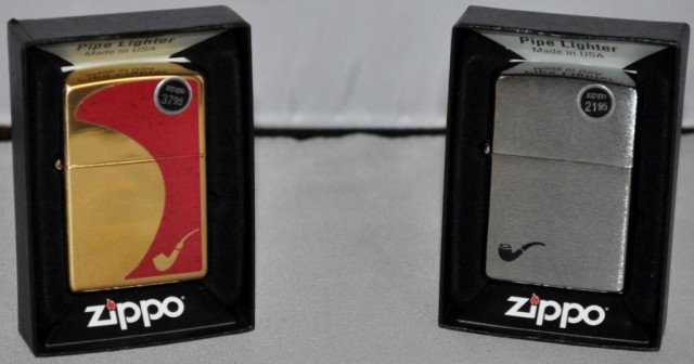 Zippo Lighters, 2 Pieces: Pipe Lighters, (1) Brass and Red Design, (1) Aluminum, Measurements: 2 1/4" 2 1/2" x 1/2"
