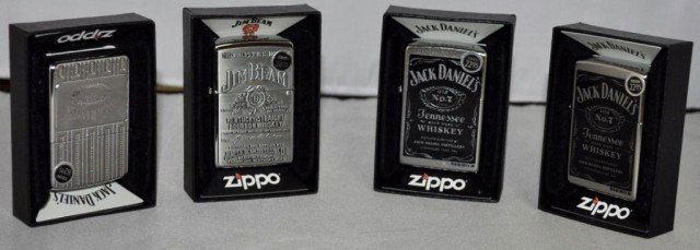 Zippo Lighters, 4 Pieces: (3) Feature Jack Daniels Tennessee Whiskey Logo, (1) Jim Beam Kentucky Bourbon, Measurements: 2 1/4" 2 1/2" x 1/2"