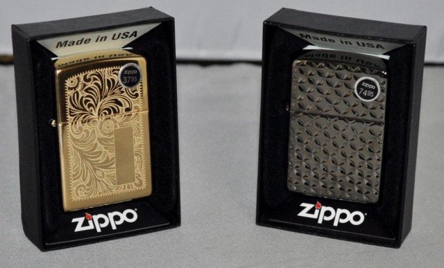 Zippo Lighters, 2 Pieces: (1) Brass With Paisley Design, (1) Brushed Metal Finish, Measurements: 2 1/4" 2 1/2" x 1/2"