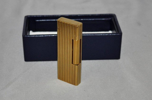 Corona Pipe Lighter: Roller Style Flint, Brass Case, Adjustable Flame, Measurements: 2 3/4" x 1" x 3/8"
