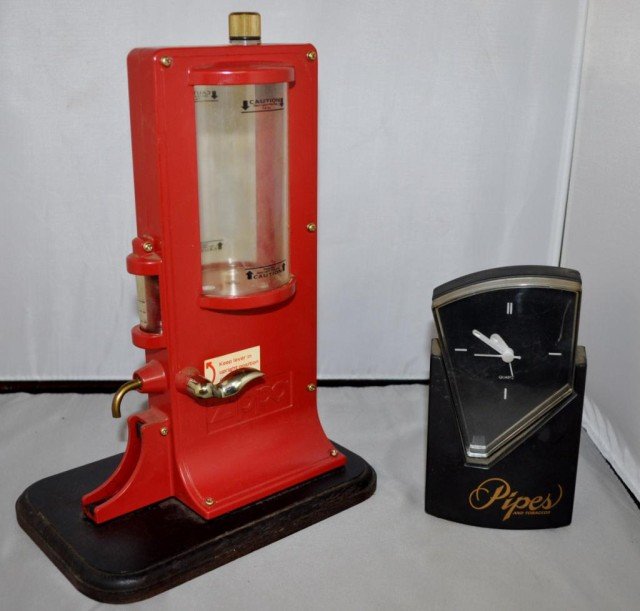 Zippo Fueling Station, Plus, 2 Pieces: (1) Zippo Brand Refueling Station, (1)"Pipes and Tobaccos" Analog Clock, Measurements: 12" x 8" x 5 1/2"