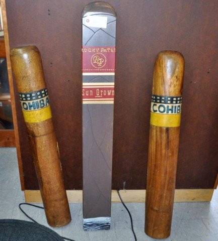 Wood Cigar Wall art: Large Wooden Cigars With Wall Mounts, (2) Cohiba, (1) Rocky Patel Sun Grown, Measurements: (1) 48" x 6" x 2 1/4" (2) 40" x 5 1/2" x 3
