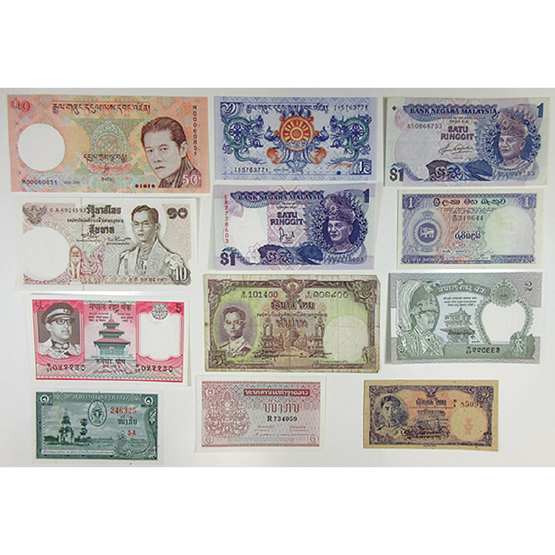Assorted Asian Issuers. 1940s-2000s. Group of 12 Issued: Group of assorted Asian issues, includes notes from Bangladesh (2); Bhutan (2); Laos (3); Malaysia (2); and Thailand (3). Generally Fine to VF, some Gem Uncirculated.