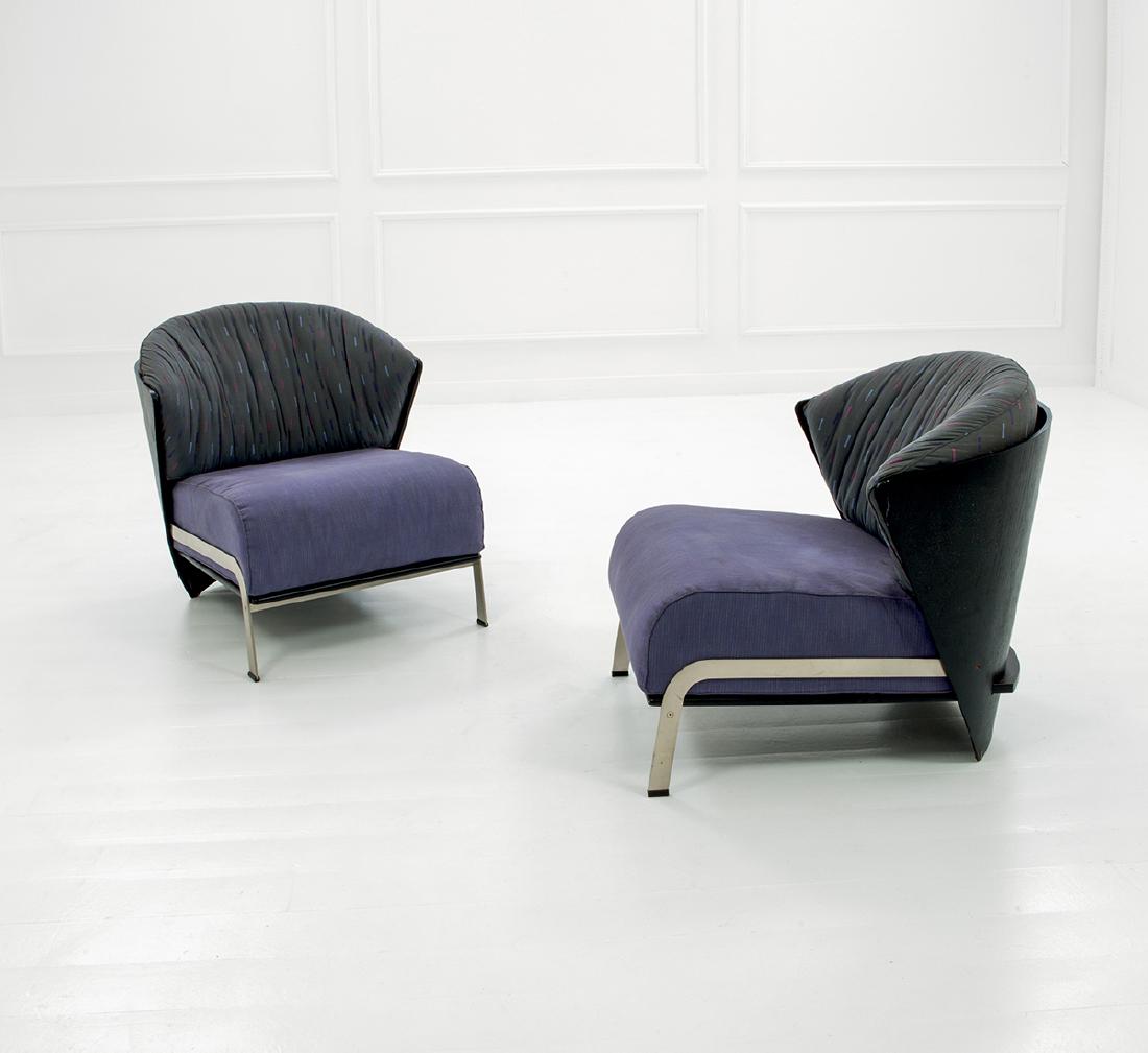 Franco Raggi: Two rare armchairs, 'Elba' model Curved veneer plywood in lacquered oak, fabric, brushed steel. Manufactured by Cappellini, 1983-85 ca. 82x77x80 cm Literature: Literature: Domus, n. 657, gennaio 1985,