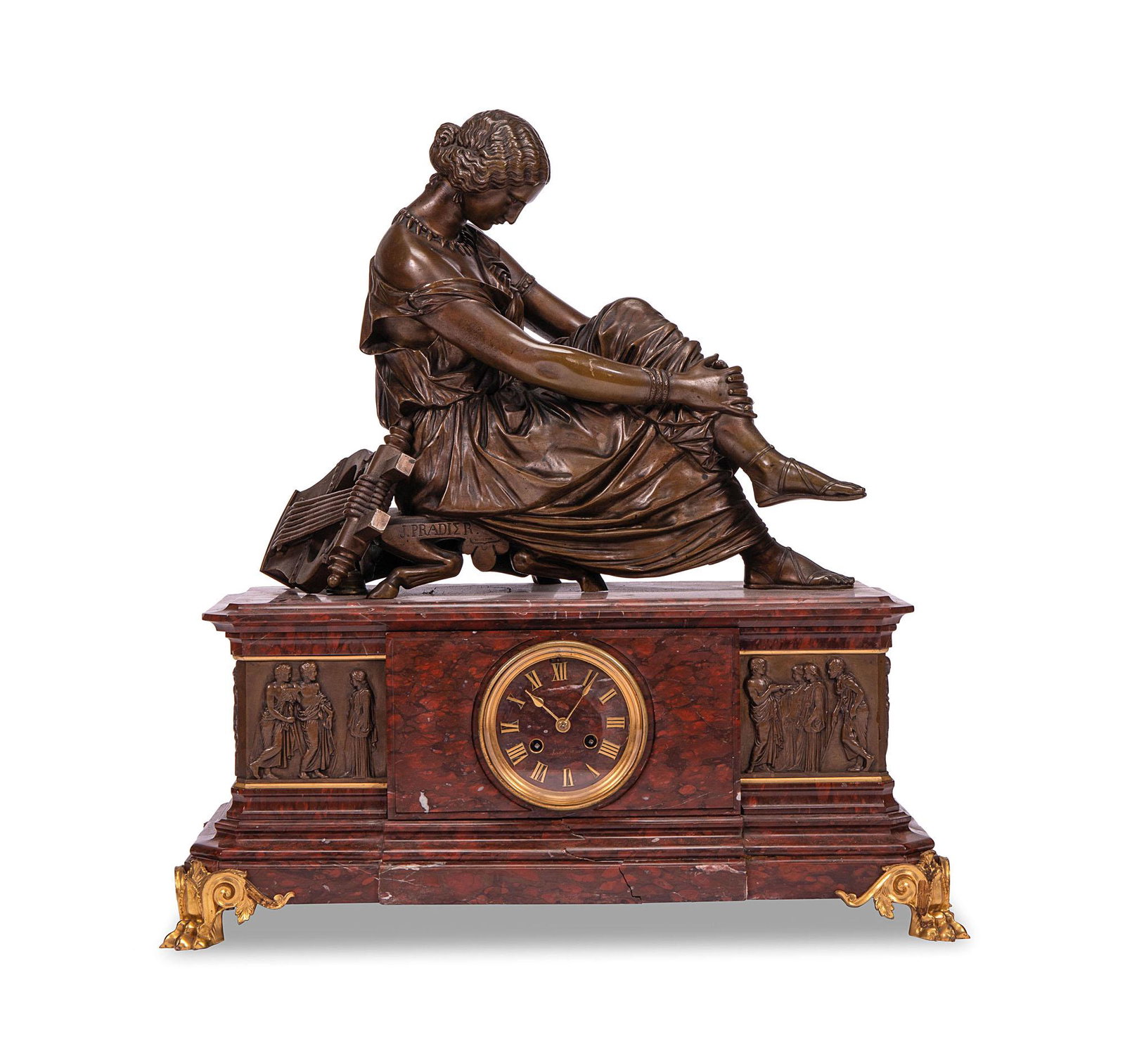 Orologio in marmo rosso: Orologio in marmo rosso con sovrastante bronzo a patina scura raffigurante l'Allegoria della Musica. Bronzo firmato J. Pradier. h cm 59