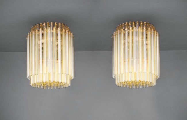 Venini: Coppia di lampadari Struttura in metallo laccato, elementi in vetro a canne trasparenti e giallo paglierino. Prod. Venini, anni '60 h cm 60, diam. cm 50