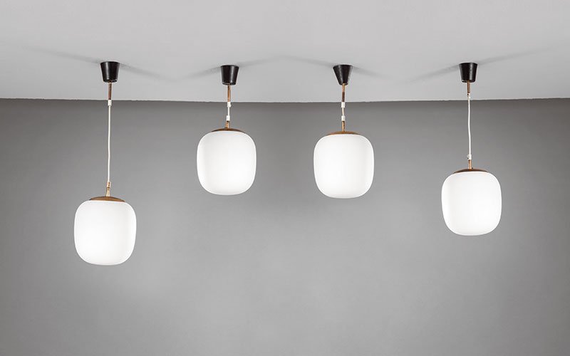 Stilnovo: Four ceiling lamps Polished brass, enamelled metal, opal glass diffuser. Manufactured by Stilnovo, 1950s Manufacturer's partial decal on three. diam. 20 cm; h 66 cm, 49 cm, 52 cm, 74 cm