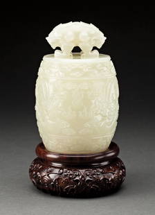 VERY FINE CHINESE WHITE JADE BELL: 18/19th century. Finely carved in the shape of a bianzhong, with double-headed mythical beast finial, the body carved in low-relief with dragons chasing flaming pearls between cloud bands. 5 in,