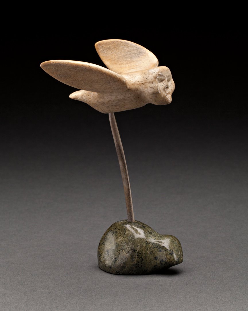 Lucy Angalakte Mapsalak (1931-): Repulse Bay, Owl Spirit, late 1960s, bone, green stone and antler, signed in syllabics, 5 x 3 x 2.5 in, 12.7 x 7.6 x 6.4 cm. ... This owl spirit (or perhaps a shaman on a spirit flight) hovers above a