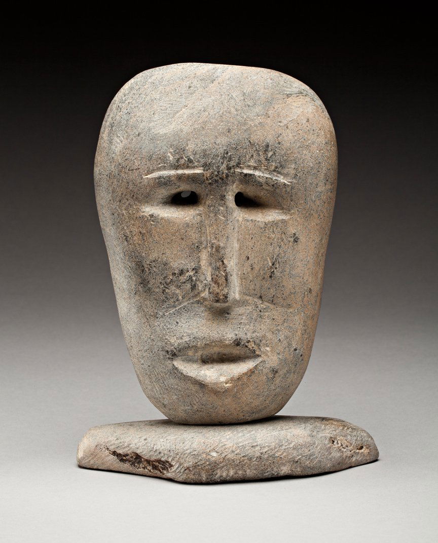 Jimmy Taipanak (1919-2000): Baker Lake, Head, ca. 1980, light grey stone, 8 x 6 x 2.25 in, 20.5 x 15 4 x 5.6 cm. ... Taipanak produced a number of raw, primal carvings of faces, almost in the manner of John Kavik. This is the be