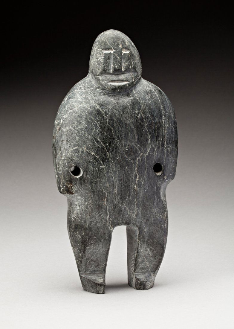 John Kavik (1897-1993): Rankin Inlet, Standing Figure, ca. late 1960s, grey stone, 10 x 5 x 2.25 in, 25.3 x 11 x 6 cm. ... This figure, carved in a relatively soft stone that made it fairly easy to finish, has a relaxed air