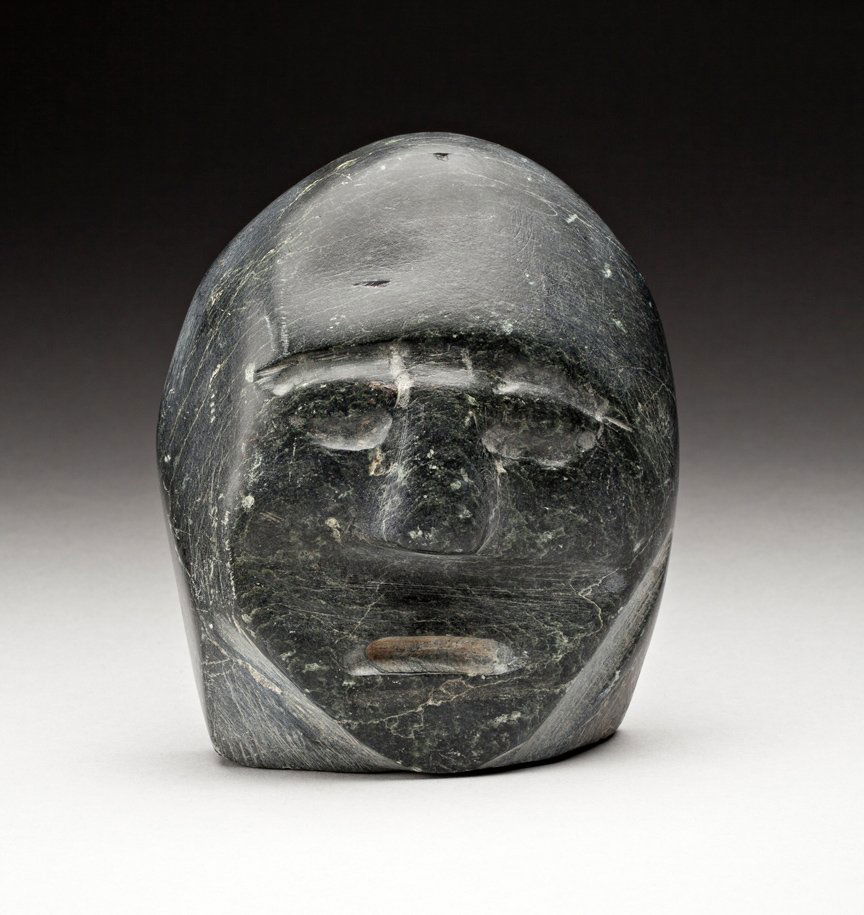 John Kavik (1897-1993): Rankin Inlet, Head, ca. mid-late 1960s, grey stone, signed in syllabics, 5.5 x 4.5 x 2.75 in,13.8 x 11.7 x 6.7 cm. ... This work is very different again, and not just because it is a head and not a fi