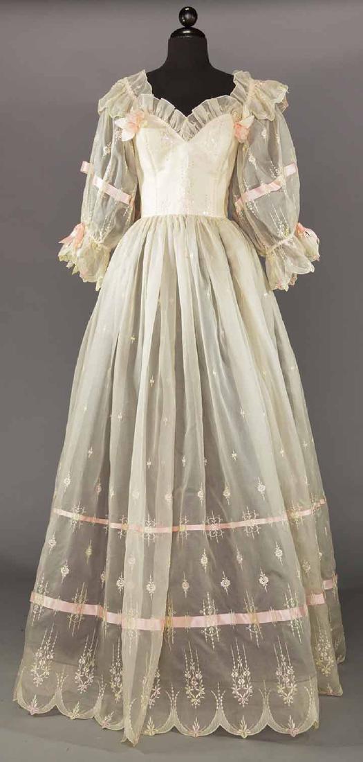 EMMANUELLE WEDDING DRESS, EARLY 1980s: Labeled, white silk organdy, pink & white sprig embroidery, sweetheart bodice trimmed w/ pearls & sequins, B 34", W 25", L 65", (shoulder elastic stretched) excellent; t/w 1 1980s ivory silk gown w/ t