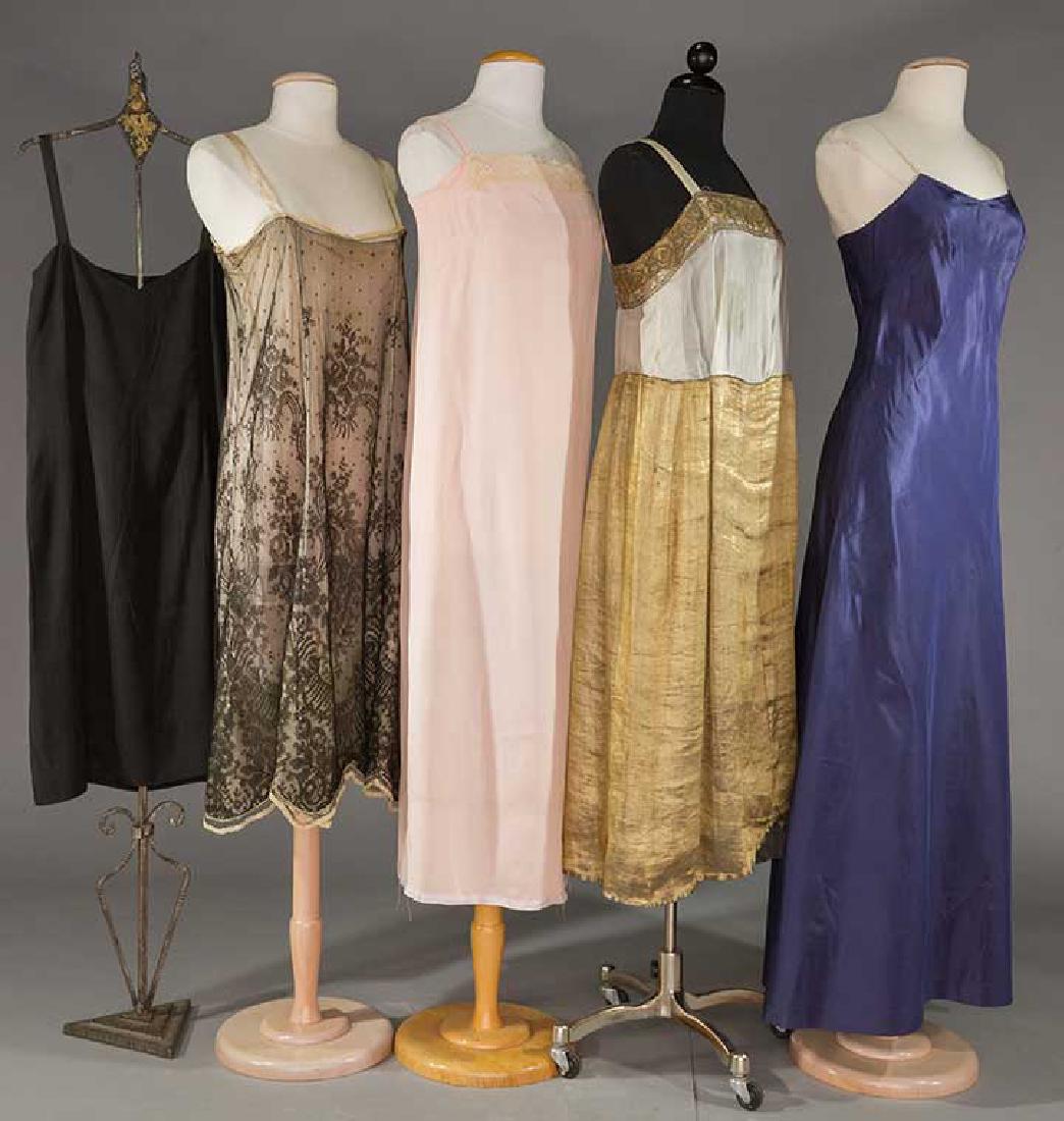 FIVE SILK SLIPS, 1920-1930: 1 black Chantilly lace over China silk, B 32"; 4 slips w/ B 34": 1 black silk w/ "Molyneux" label, 1 navy, 1 pink & 1 ivory top w/ gold lame skirt, (stain & small hole to ivory top) 1 fair, 4 very goo