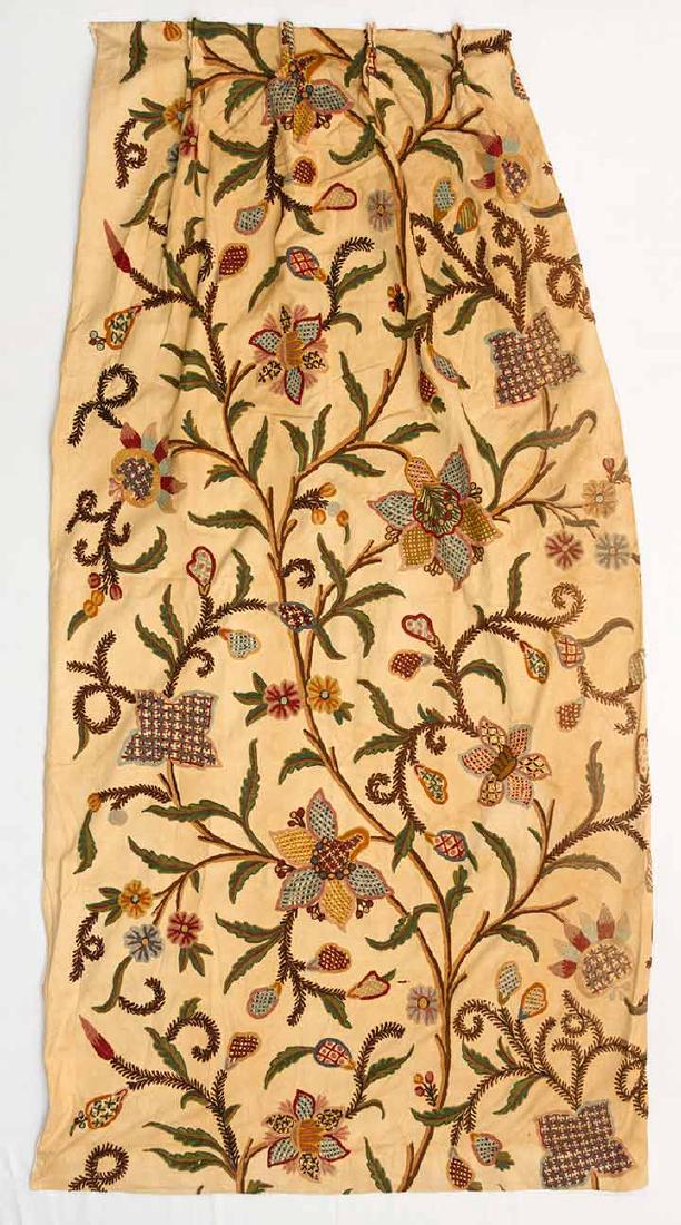PAIR CREWEL EMBROIDERED CURTAINS: Wool embroidery on heavy tan cotton, each 45" x 90", (some water stains & tears) fair.