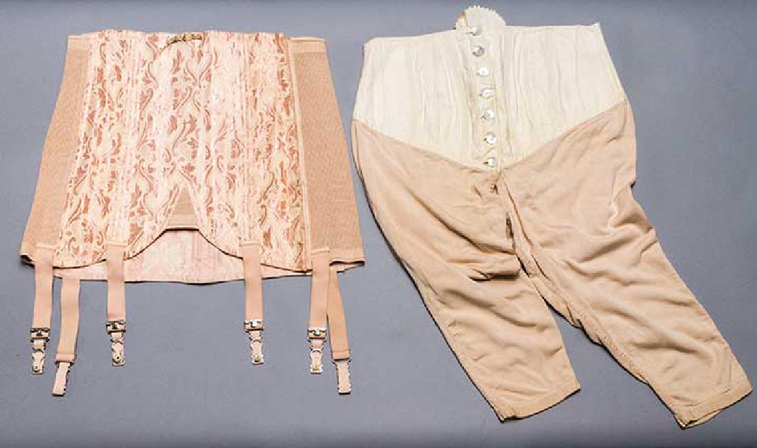 1 MAN'S & 1 WOMAN'S GIRDLE, 1920-1930s: Lady's 1930s deadstock girdle, pink satin brocade, silk & elastic side panels, back laces, H 40", excellent; man's 1920s white cotton tummy girdle, corded stays, 7 CF m-o-p buttons, back lacings, fles