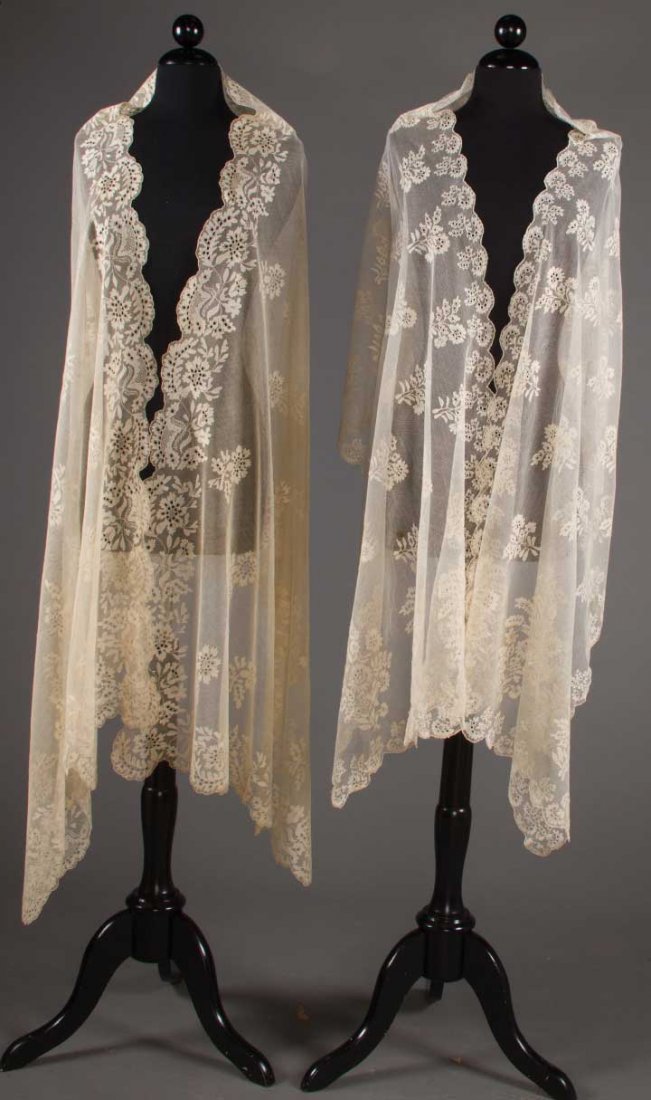 TWO BOBBIN LACE STOLES, 1820-1840: Both white w/ repeats of large florals in ground & blossoms to scalloped edges, 1 30"x93", excellent & 1 22.5"x92", (3 small stains at 1 end) very good.