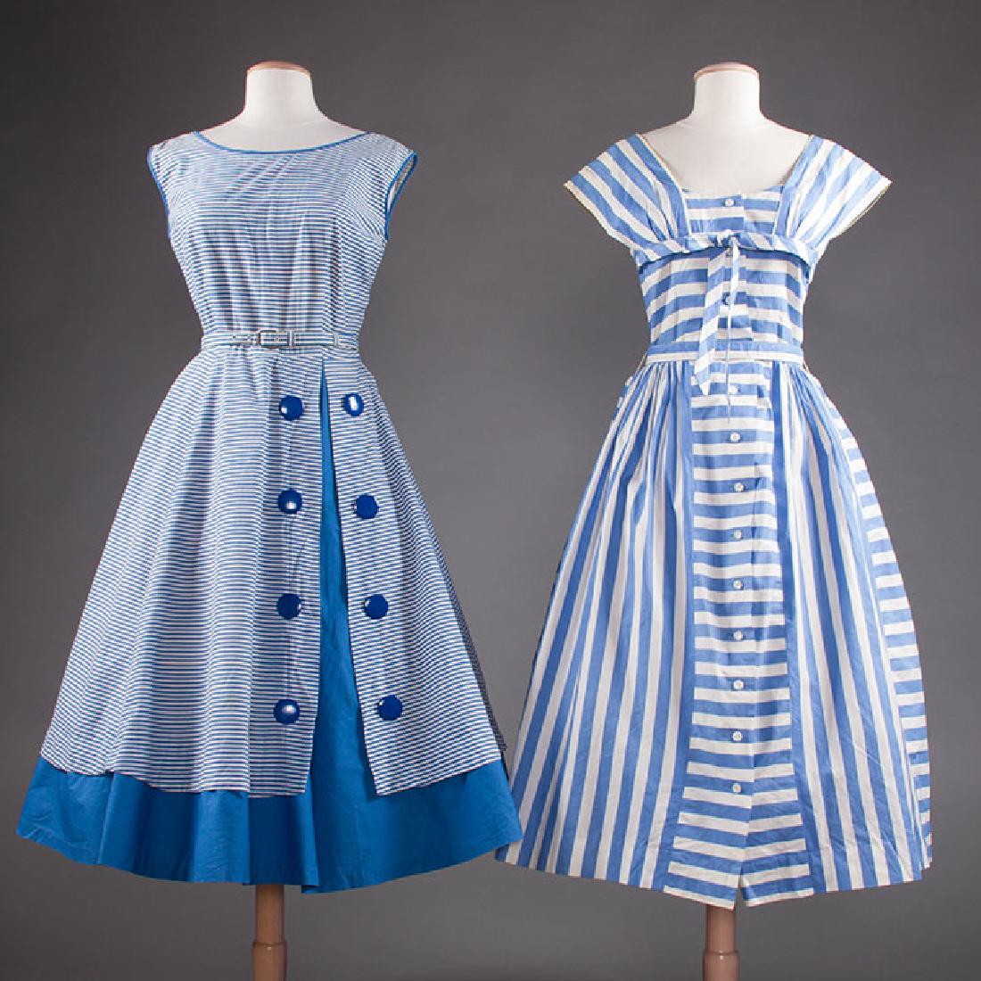 2 BLUE & WHITE COTTON DRESSES, 1950s: 1 narrow striped, large blue plastic buttons, B 36", W 28", (1 pale CF hem stain); 1 sundress w/ wide stripes, self-tie belt, B 35", W 28", (scattered stains & straps crudely sewn) both very good.