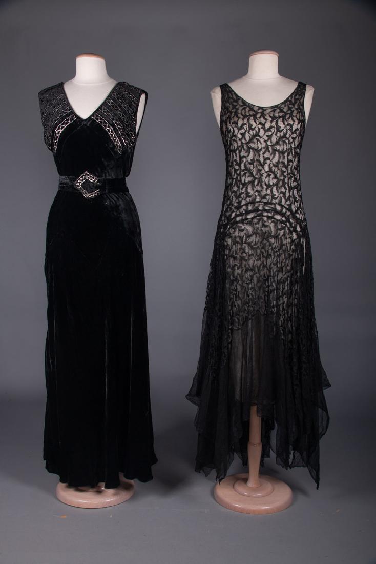 TWO BLACK EVENING GOWNS, 1930s: 1 all lace w/ handkerchief hem skirt, B 34â€, W 28â€, L 46-58â€, (tears at left H, small holes in net, pulls); 1 velvet, bodice w/ rhinestone bands & belt buckle, B 38â€, W 29â€, L 55â