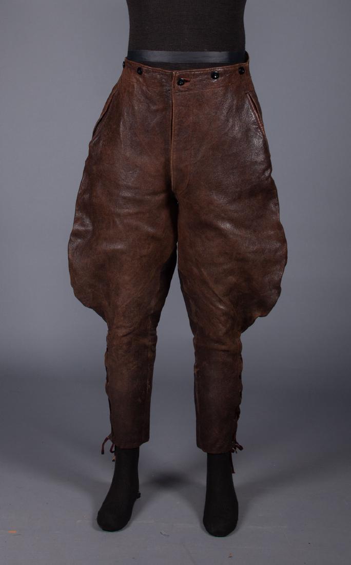 AVIATOR LEATHER JODHPURS, EARLY 20TH C: Dark brown, CB W buckle, 3 inset pockets, leg bottoms lace, flannel lining, W 34"-37", Ins 25", (small leather patch at back leg hem) very good.