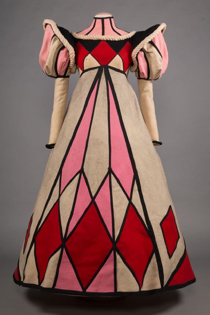 BOB MACKIE EMMY AWARD COSTUME, 1966: Pink, black, cream & red wool color block Queen of Diamonds costume for TV Movie, "Alice Through the Looking Glass", which won 1st Emmy for costume design category, B 34", W 30", L 57", (pilling, zipp