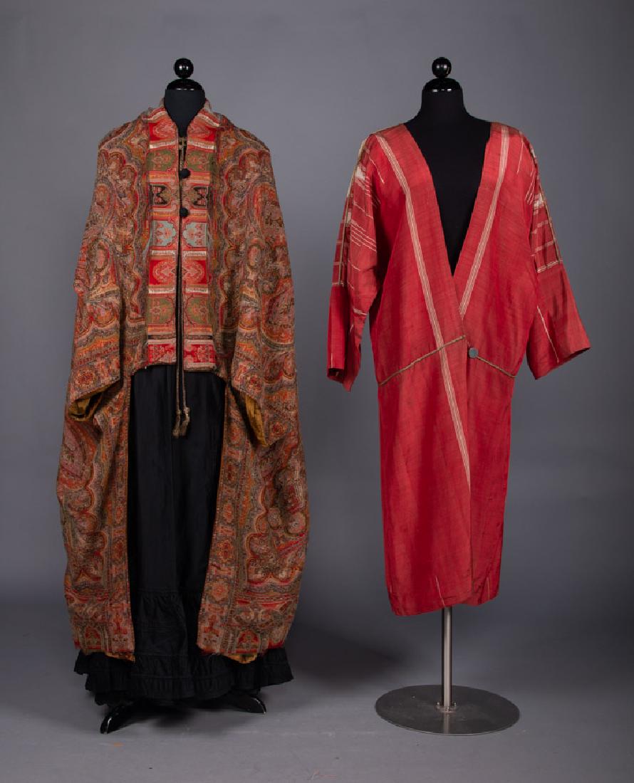 WOOL PAISLEY CAPE & SYRIAN ABA, 1880 & 1910: Cape fashioned from back of paisley textile CF L 26", CB L 48", (frayed collar, small moth holes CF W right side & front hem, 1" rip at side seam) fair; red & white Syrian aba coat, L 46", (holes in C