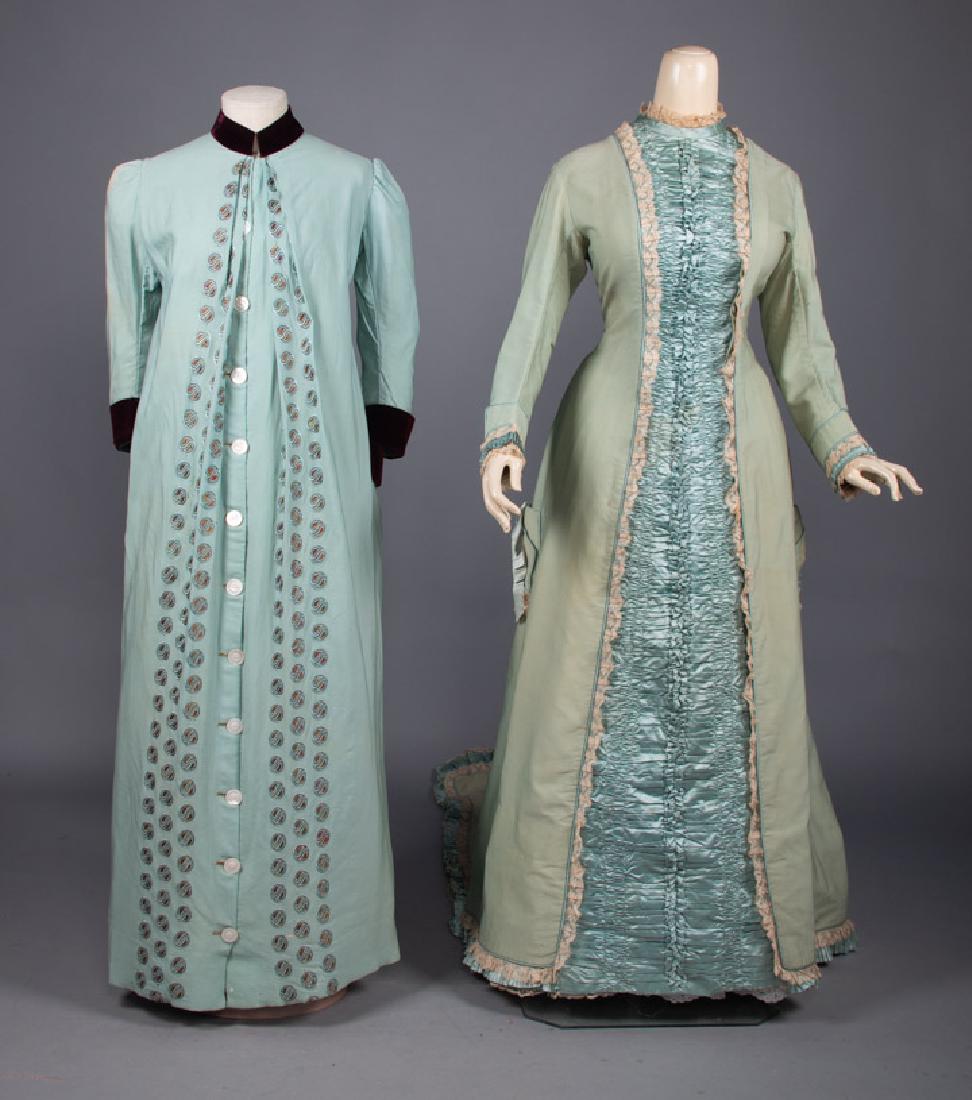 TWO WOOL MORNING BUSTLE ROBES, 1870-1880s: 1 light green bustle & trained robe w/ blue silk CF panel, B 36", W 29", L 55"-85", (tiny moth holes, 6" x 7" cream stains in train & at H); 1 baby blue robe w/ maroon velvet cuff, collar & pocket tri