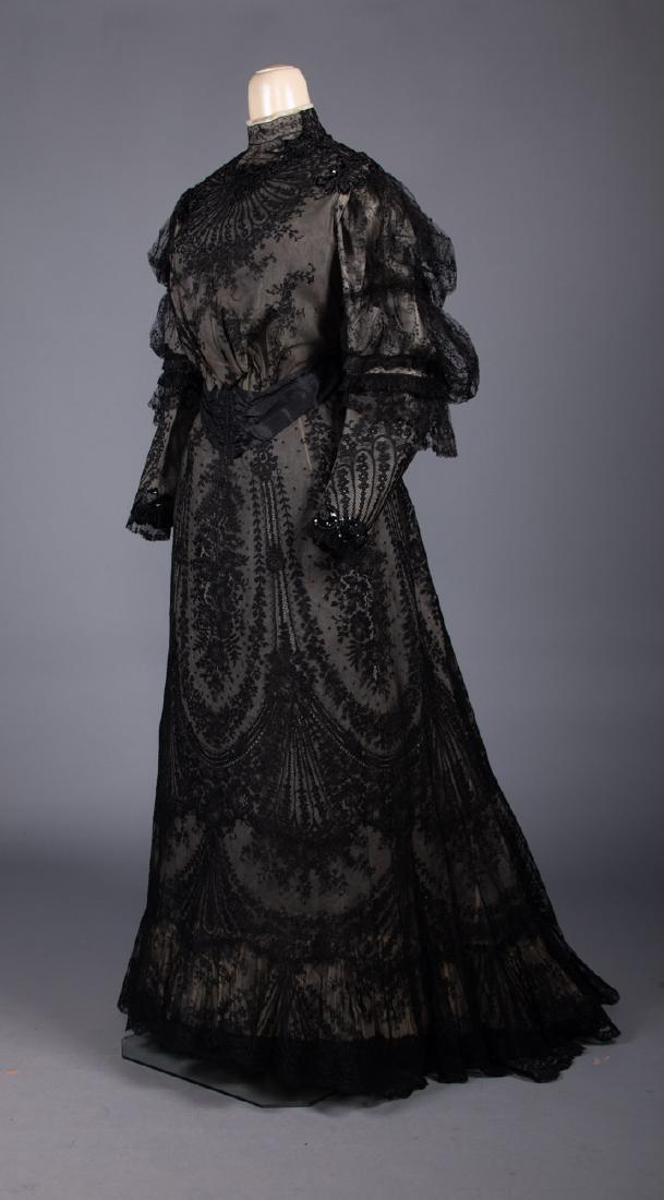 TWO BLACK DINNER GOWNS, 1890s: Both 2-pc: 1 chantilly lace w/ sequined & beaded velvet appliques, c. 1900, B 38", W 29", Skt L 40-52", (cream chiffon lining damaged, moth holes in CF hem) fair & 1 silk moire in ribbon pattern, blac
