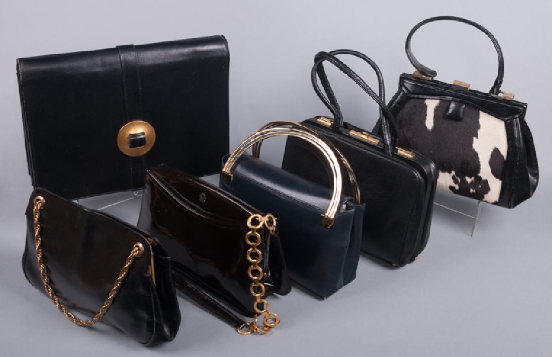 SIX LEATHER HANDBAGS, 1950-1980: "Koret" w/ gold chain; all black "Koret"; Navy w/ handle labeled "Made in Italy"; Robert Lee Morris 80s clutch; long gold handle labeled "Germain Guerin, Paris", (wear inside frame) all good- excellen
