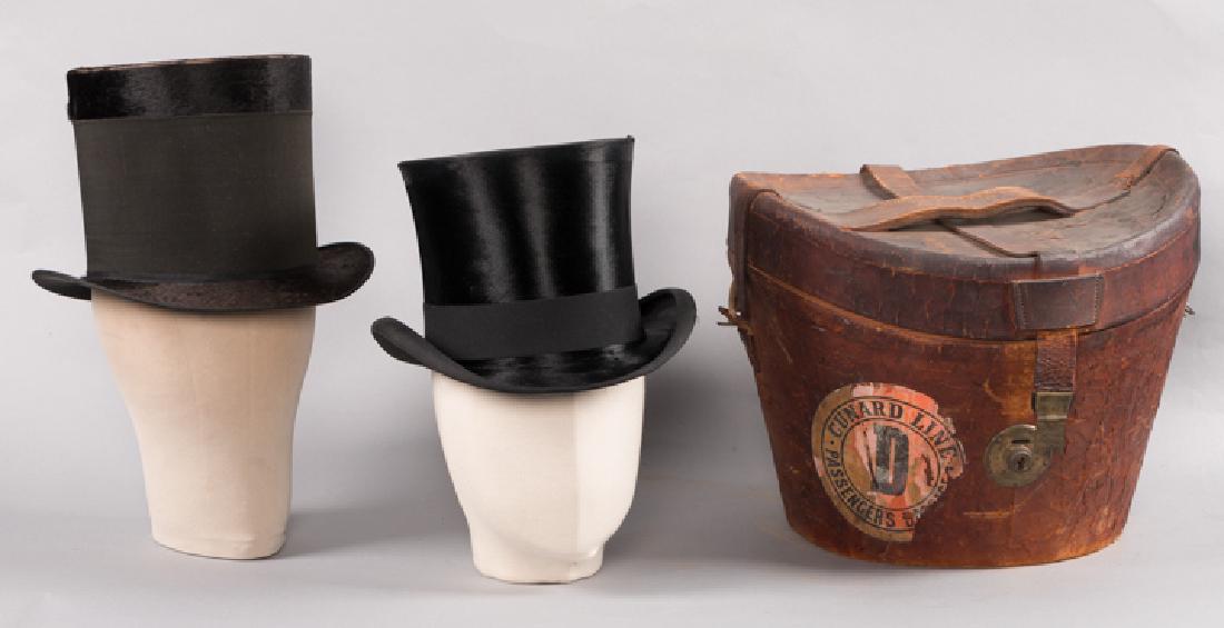 TWO AMERICAN TOP HATS, ONE WITH LEATHER BOX, 1860s: Both silk faux fur: 1 mid-19th C. w/ high ribbon band & "Brattleboro, VT" interior label, (wear at crown edge), very good; 1 late 19th C. , interior labeled "Knox, New York" w/ original leather box w/