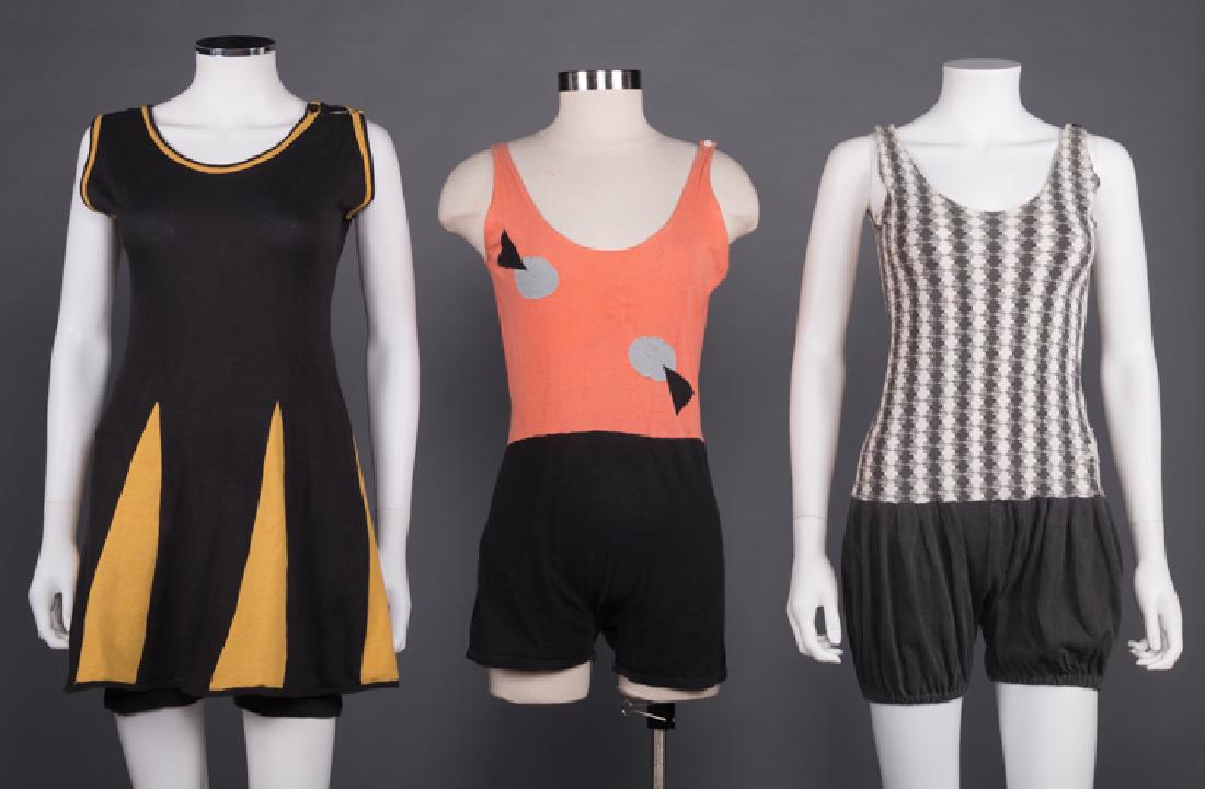 THREE SWIMSUITS & ONE BEACH TOWEL, 1920-1930s: All cotton knit: 1 black & yellow 2-pc, B 36", H 40", L 34", (missing 1 button), excellent, 1 orange & black color block w/ deco appliques, B 38", H 40", L 30", (repairs CF- missing patch, detached bi