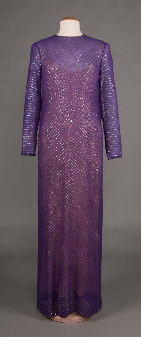 HALSTON PURPLE SEQUINNED EVENING GOWN, LATE 1970s: Purple chiffon w/ rows of purple sequins in chevron & circular patterns, dress & slip labeled "Halston", B 34", H 40", L 60", (slip hem mended, pinhole CF below neckline) very good.