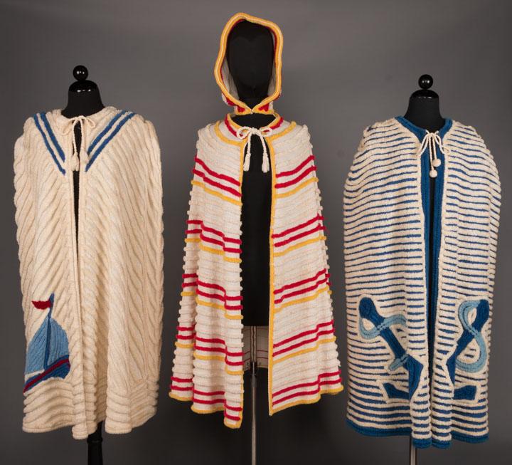 THREE CHENILLE BEACH CAPES, 1930s-1940s: 3 1940s cotton terrycloth chenille beach capes, all free size w/ rope ties at neck: 1 red, white & blue boat & sailor motif, c 1945, (dirty at neck & left side hem) very good ; 1 white, red & yellow w