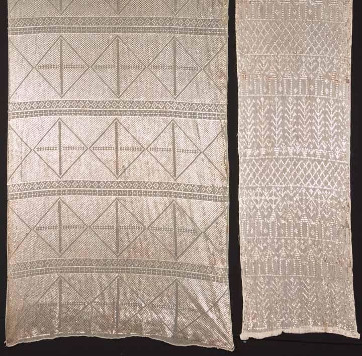TWO SILVER ASUITE SHAWLS, EGYPT, 1920s: 1 grey & silver in diamond pattern, WD 26", L 88", (tarnish streak below center, few smaller tarnished areas) & 1 white & silver, WD 15", L 82", (several tarnished areas, small stains to 1 end) both g