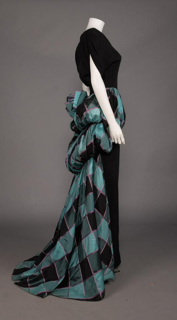 DOROTHY O'HARA TAFFETA EVENING GOWN, c. 1945: Black silk crepe evening column w/ checked panier & trained bustle skirt, short sleeve w/ ruching at SH, train loops for dancing, label "Dorothy O'Hara", B 36", W 25", L 62", (stains scattered through