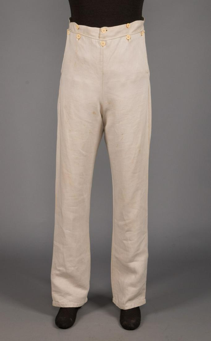GENTS CREAM LINEN FALL-FRONT TROUSERS, AMERICAN, c.: Pair of heavy cream linen drop-front trousers w/ bone buttons, American c. 1840, W 35", Ins 32", (missing buttons under left cuff, few spots in lap & rear, 1" repair above left pocket) very good.