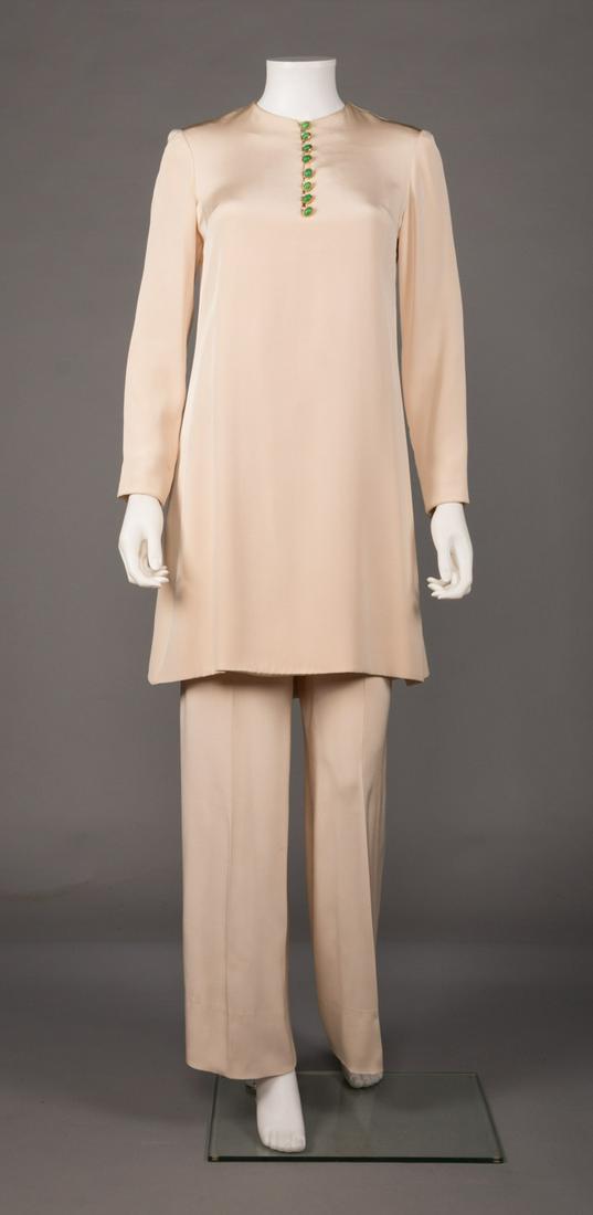 MME GRES PANT SUIT, PARIS, 1960s: Unlabeled off-white silk evening ensemble c/o long sleeve tunic & wide leg pants embellished w/ gold & green cabochon buttons at CF & cuffs, B 36", Low W 28", Ins 28", Top L 34", (loose zipper seam, 1