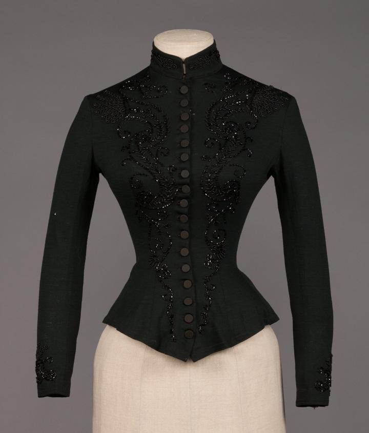 TWO RIDING SKIRTS AND ONE BODICE, 1880- 1920s: 2 skirts: 1 1928 brown wool & suede, abbreviated back w/ button & snap closure, suede panel, label "Nardi", W 30", (1x1" above CF hem, 2 small holes at left H); 1 ecru coarse linen, c 1900, left H poc